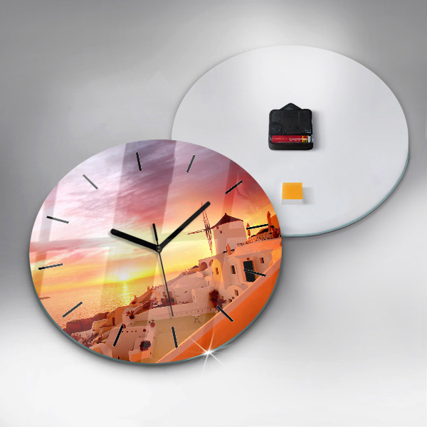 Round glass clock Old windmill in Santorini
