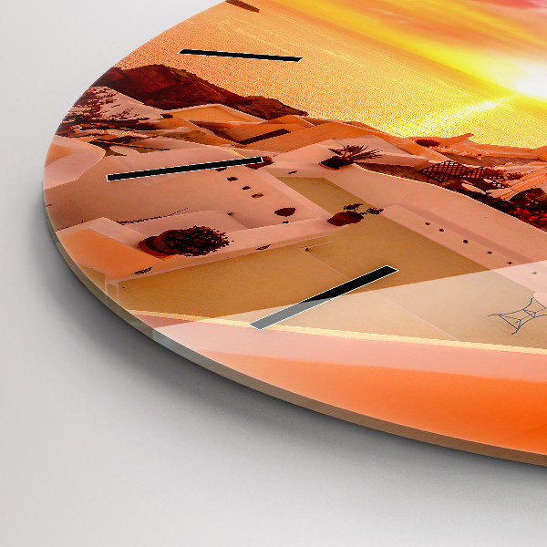 Round glass clock Old windmill in Santorini