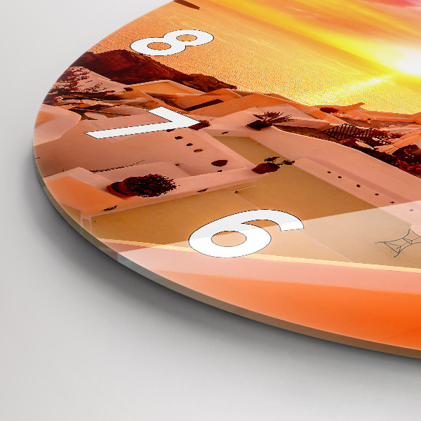 Round glass clock Old windmill in Santorini