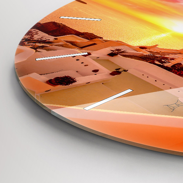 Round glass clock Old windmill in Santorini