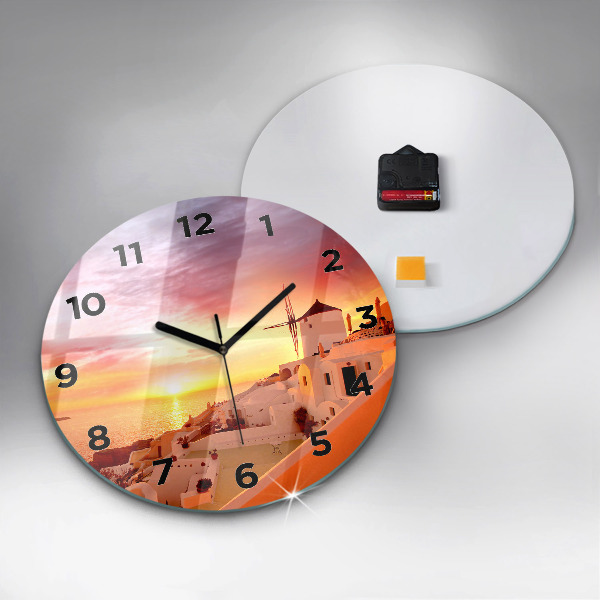 Round glass clock Old windmill in Santorini