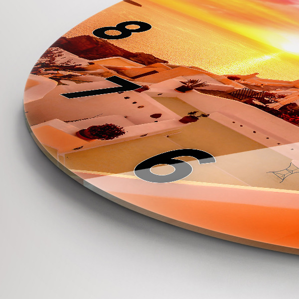 Round glass clock Old windmill in Santorini