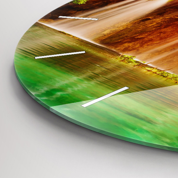 Round glass clock View of the waterfall