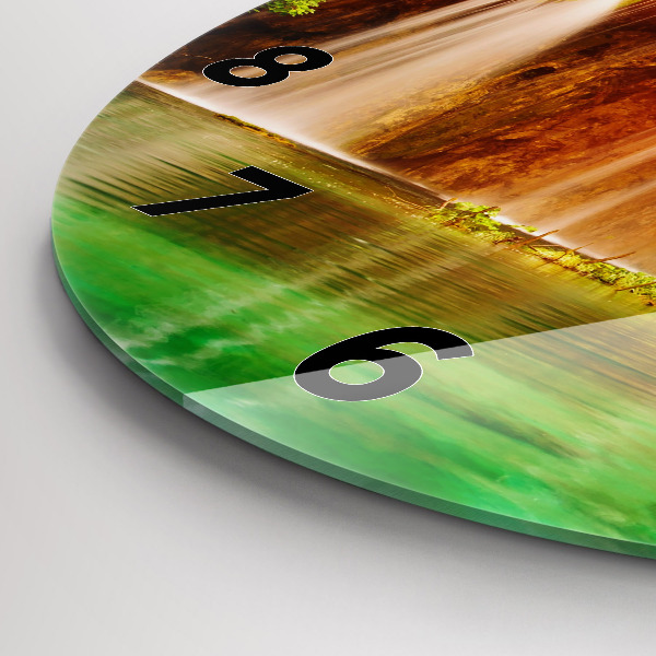 Round glass clock View of the waterfall