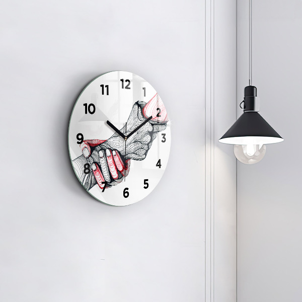 Round glass clock Holding hands