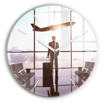 Round glass clock Man at the airport