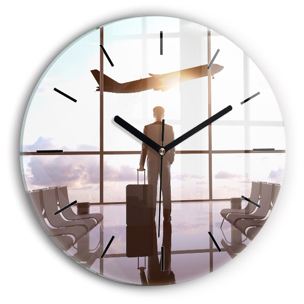 Round glass clock Man at the airport