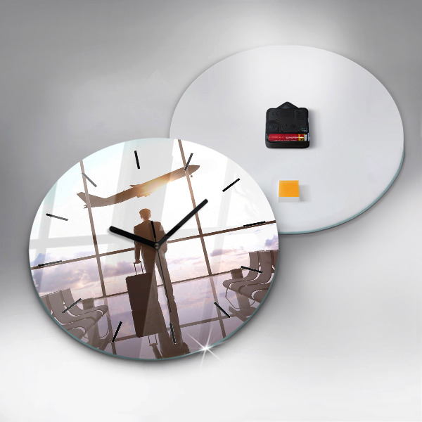 Round glass clock Man at the airport