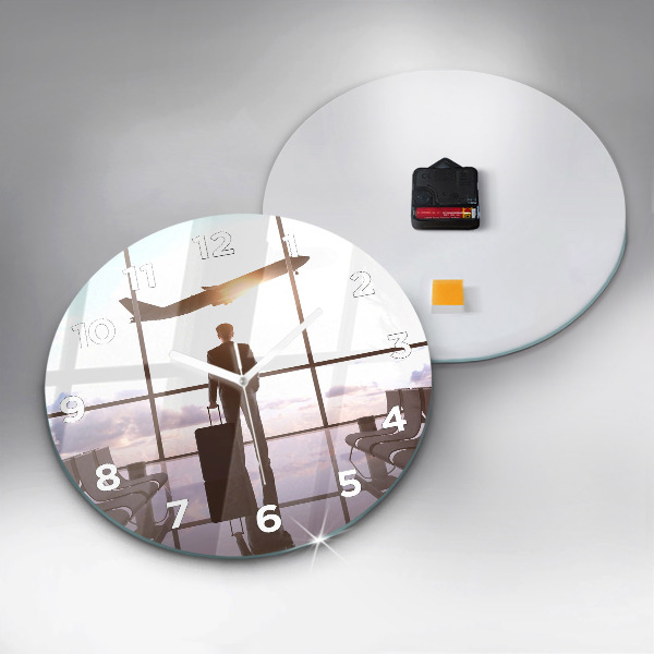 Round glass clock Man at the airport