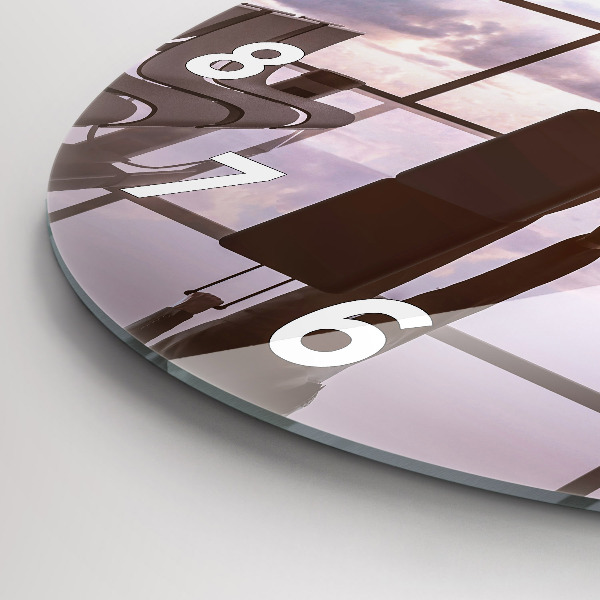 Round glass clock Man at the airport