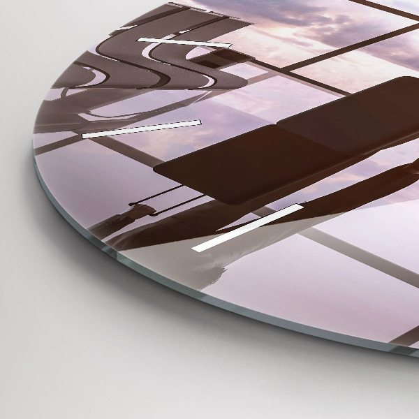 Round glass clock Man at the airport