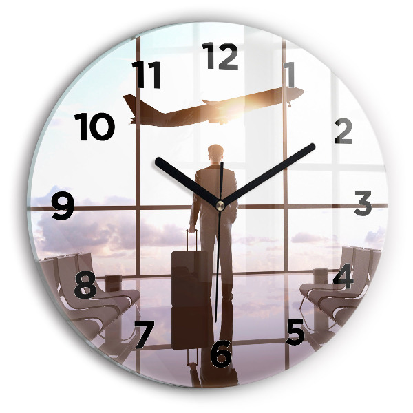 Round glass clock Man at the airport