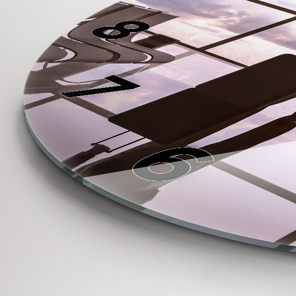 Round glass clock Man at the airport