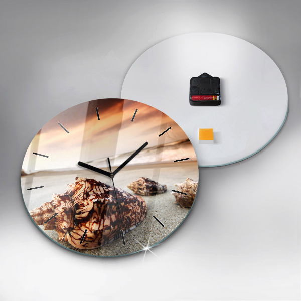 Round glass clock A shell on the beach
