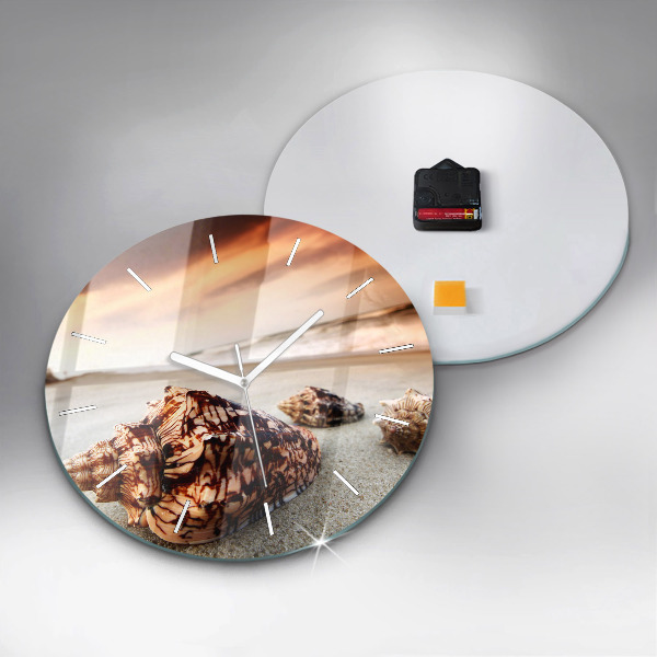 Round glass clock A shell on the beach