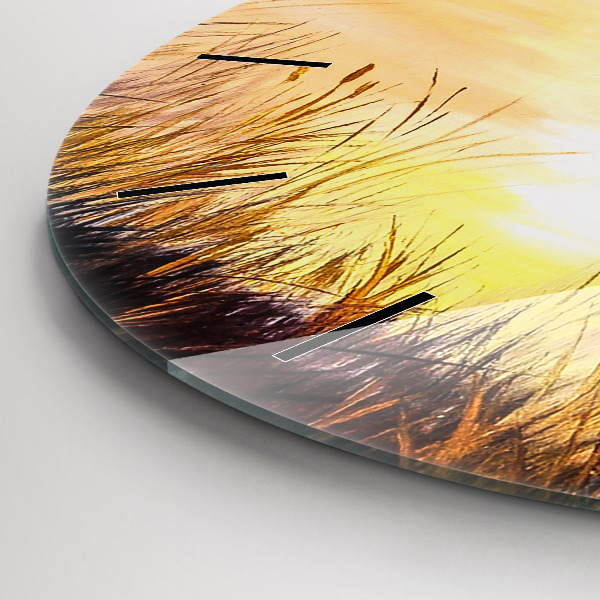 Round glass clock Cranes at sunset