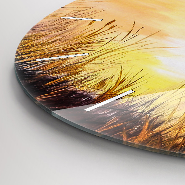 Round glass clock Cranes at sunset