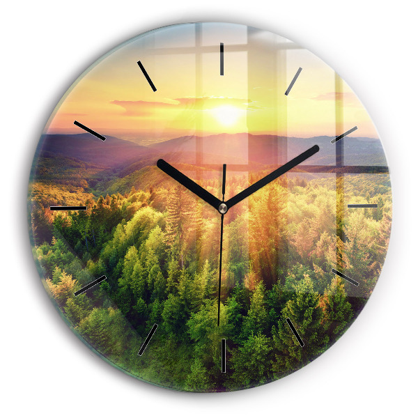 Round glass clock Sunset over the hills