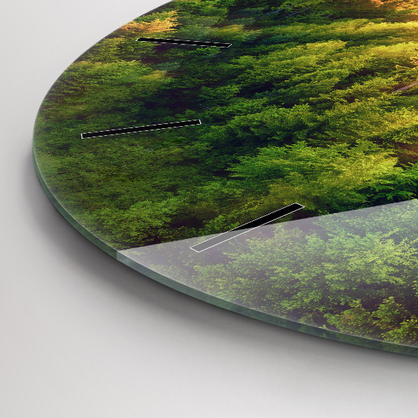 Round glass clock Sunset over the hills