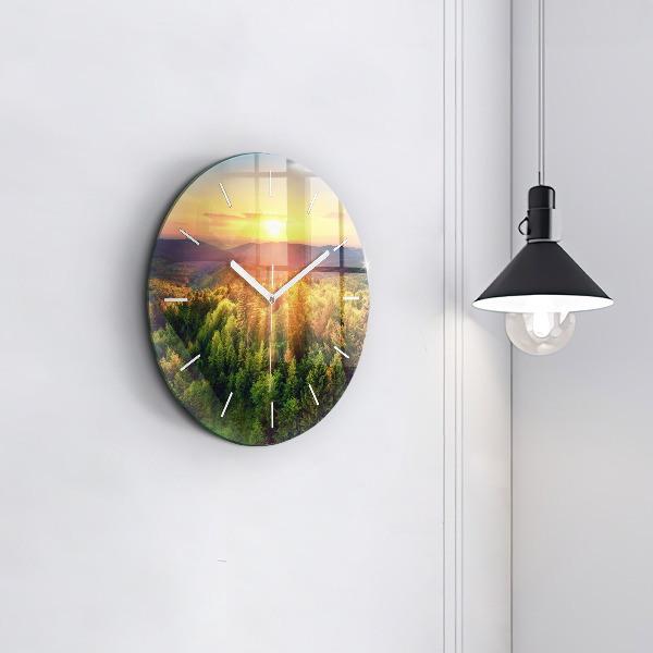 Round glass clock Sunset over the hills