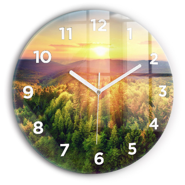 Round glass clock Sunset over the hills