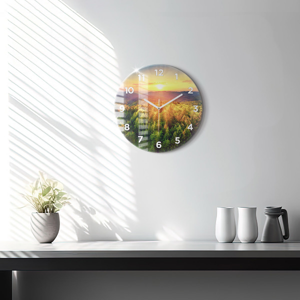 Round glass clock Sunset over the hills