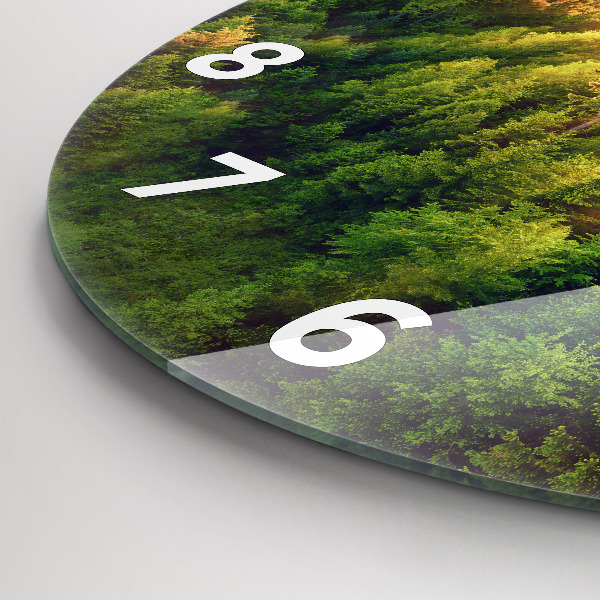 Round glass clock Sunset over the hills