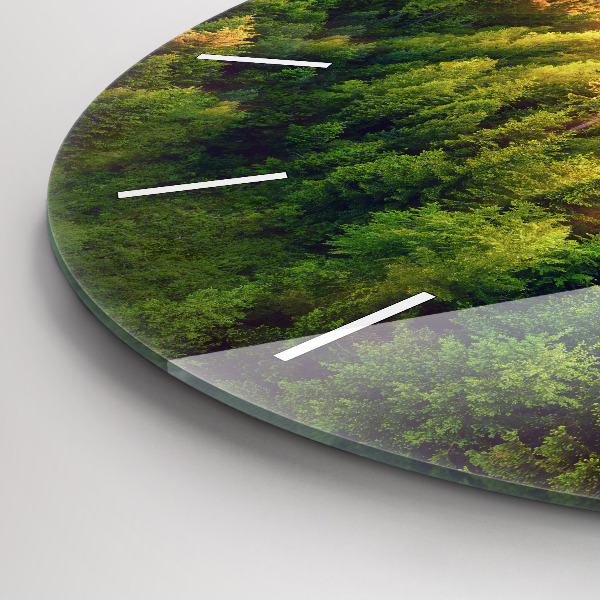 Round glass clock Sunset over the hills