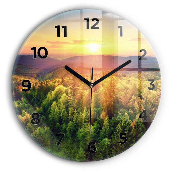Round glass clock Sunset over the hills