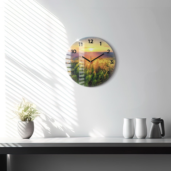 Round glass clock Sunset over the hills