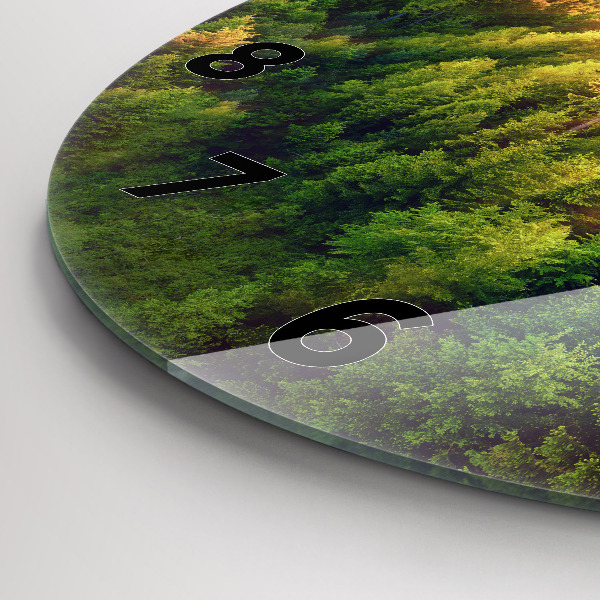 Round glass clock Sunset over the hills