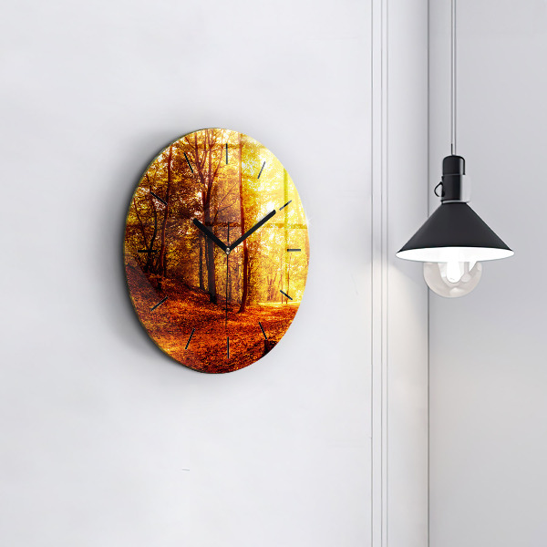 Round glass clock Forest landscape in the sun