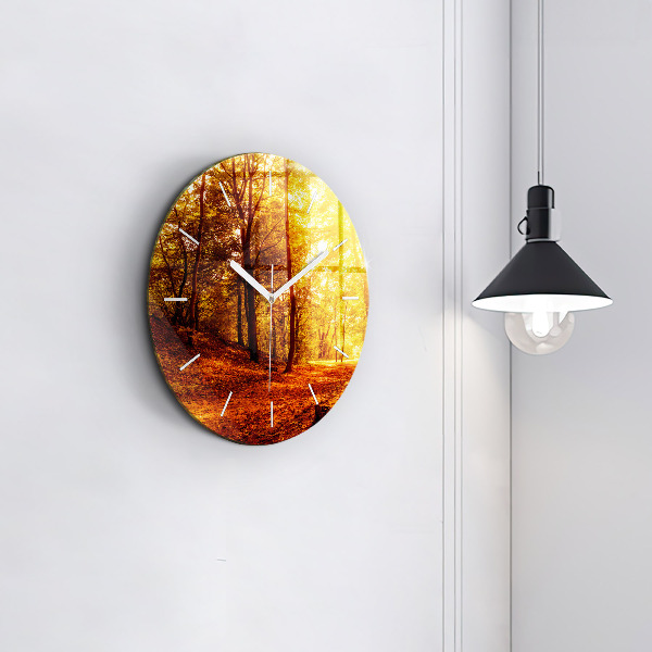 Round glass clock Forest landscape in the sun