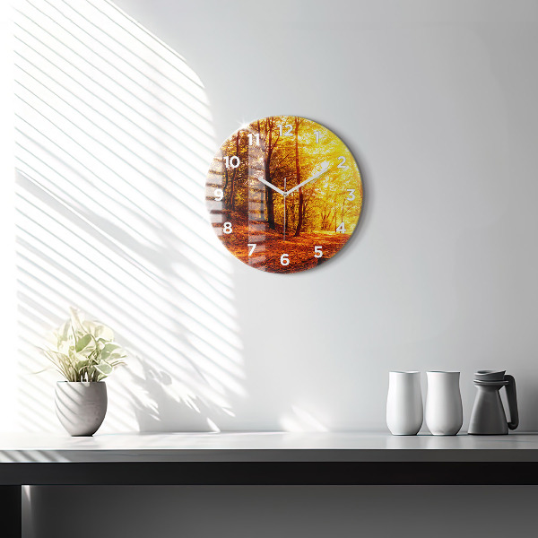 Round glass clock Forest landscape in the sun
