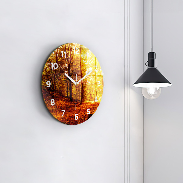 Round glass clock Forest landscape in the sun