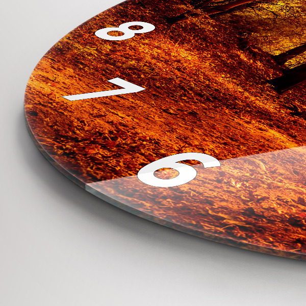Round glass clock Forest landscape in the sun