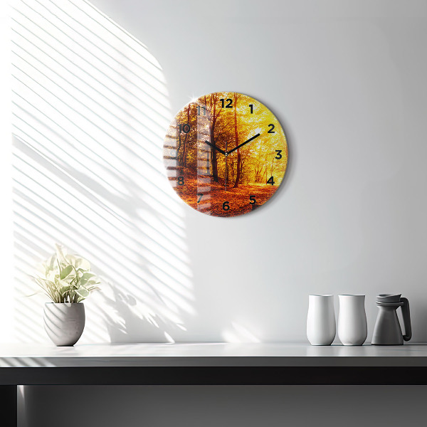 Round glass clock Forest landscape in the sun