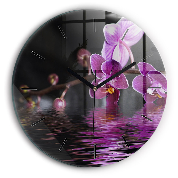 Round glass clock Orchid flower on the water