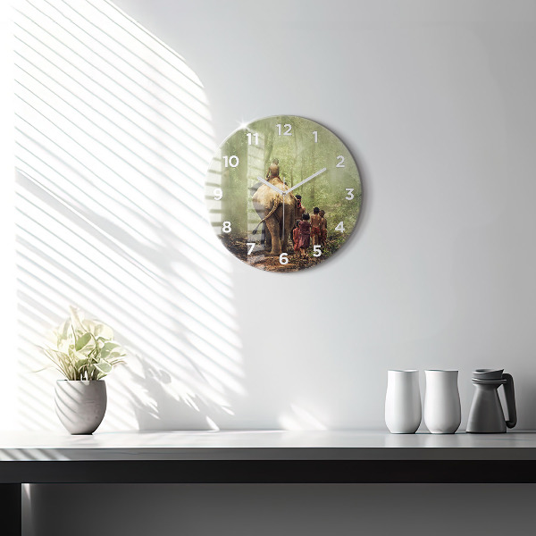 Round glass clock Children leading an elephant