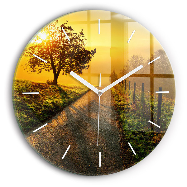 Round glass clock Fog at sunrise