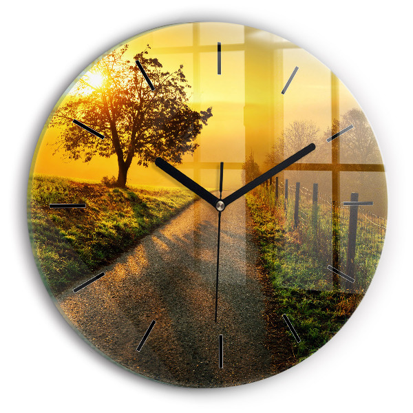 Round glass clock Fog at sunrise