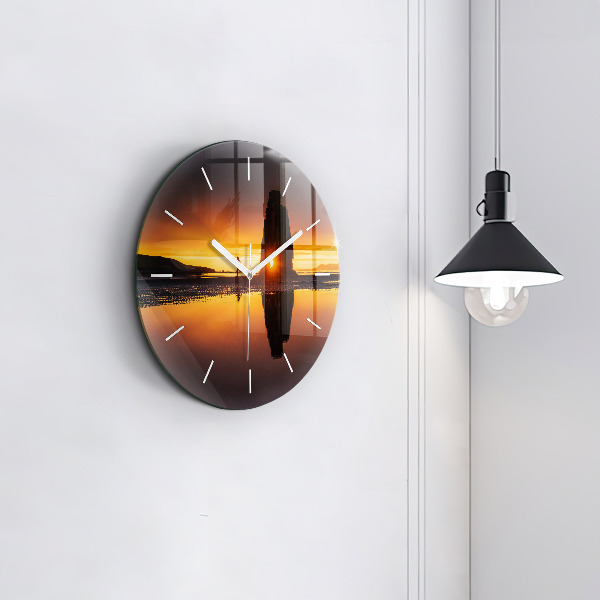 Round glass clock Runner and sunset
