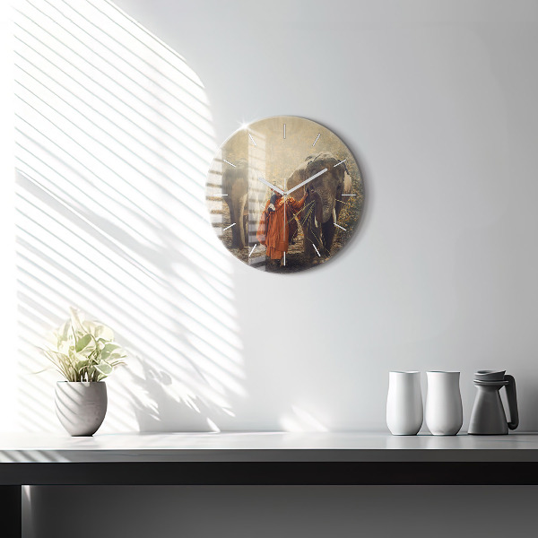 Round glass clock Monk leading elephants