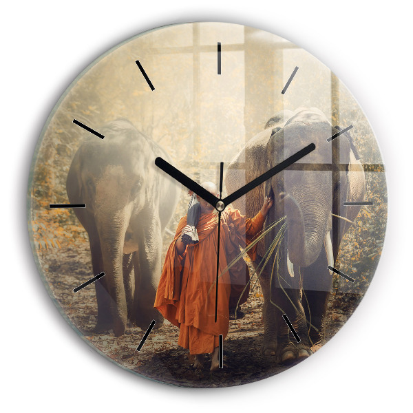 Round glass clock Monk leading elephants