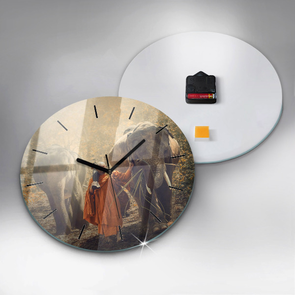 Round glass clock Monk leading elephants
