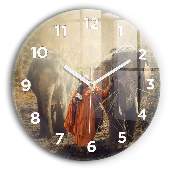 Round glass clock Monk leading elephants