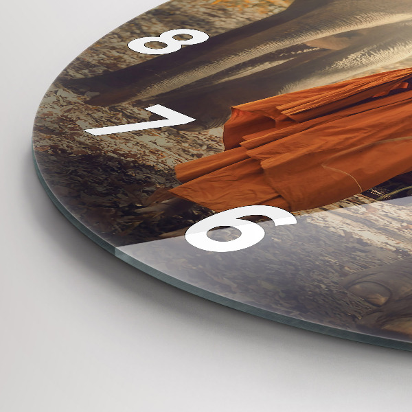Round glass clock Monk leading elephants