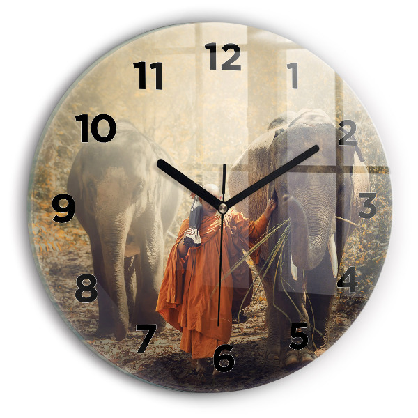 Round glass clock Monk leading elephants