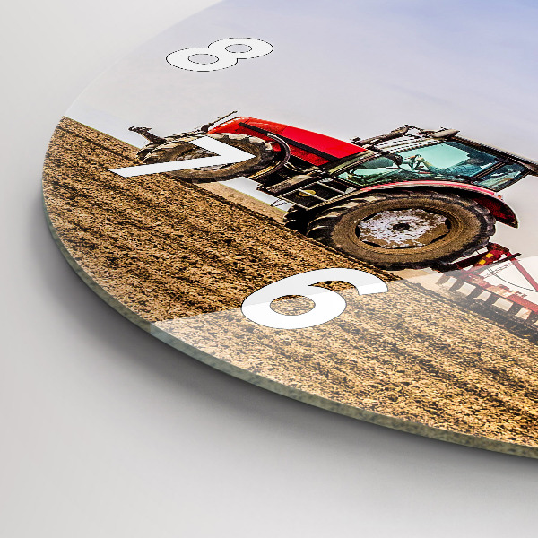 Round glass clock Farmer on a tractor