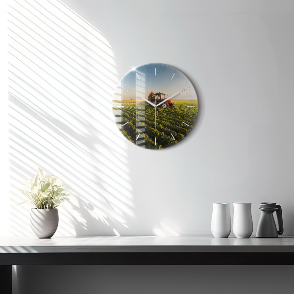 Round glass clock Tractor in a farm field